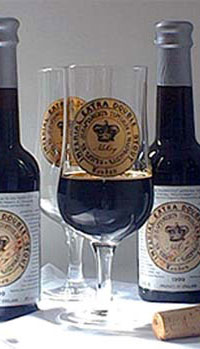 A. Le Coq's Imperial Extra Double Stout 11.2oz bottles & glass.